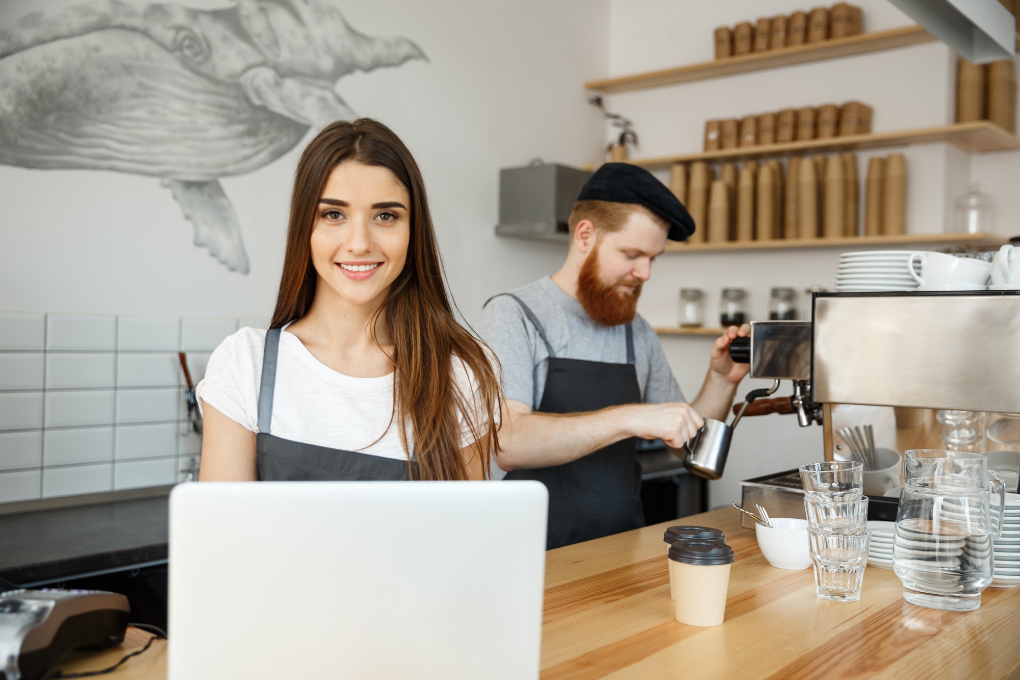 Coffee Business Concept – beautiful caucasian bartender barista or manager working and planing in Coffee Business Concept - beautiful caucasian bartender barista or manager working and planing in