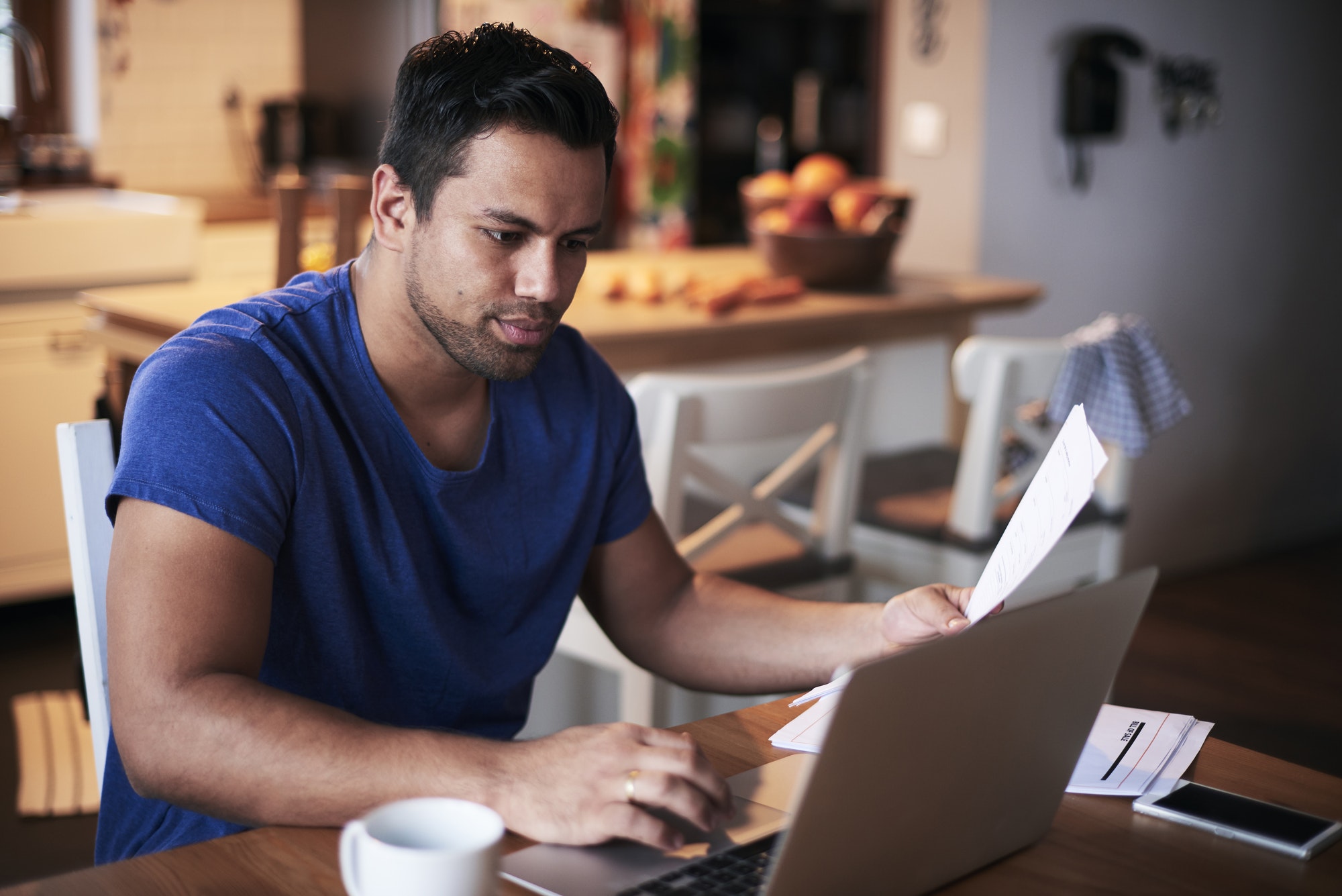 Man using a laptop at home